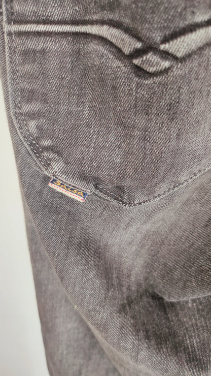 Jeans elásticos en negro desgastado